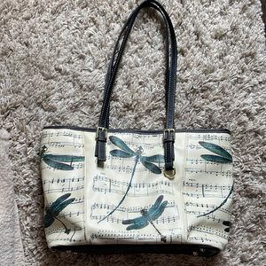 Womens tote style cream colored handbag with dragonflies